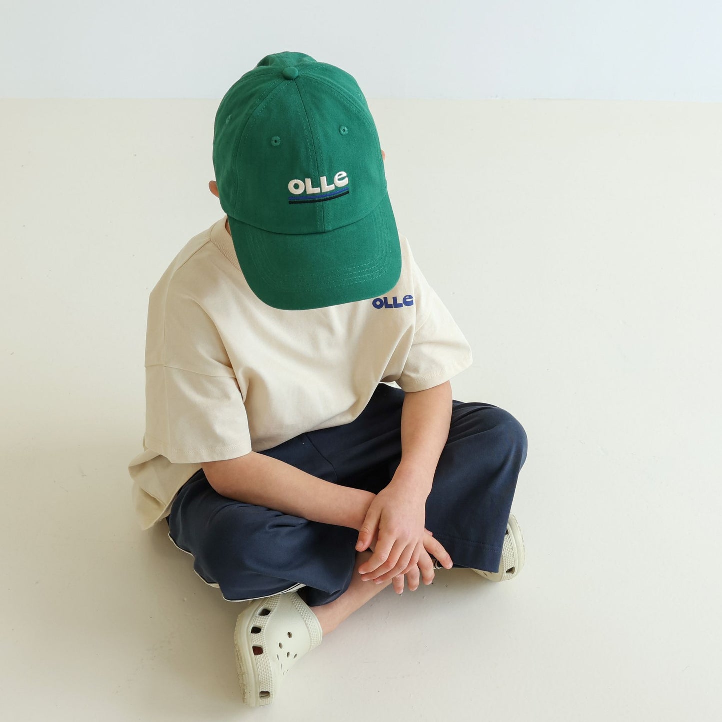 Children’s and adults’ adjustable organic cotton cap by OLLE, deeper profile with relaxed construction, responsibly made and eco-dyed