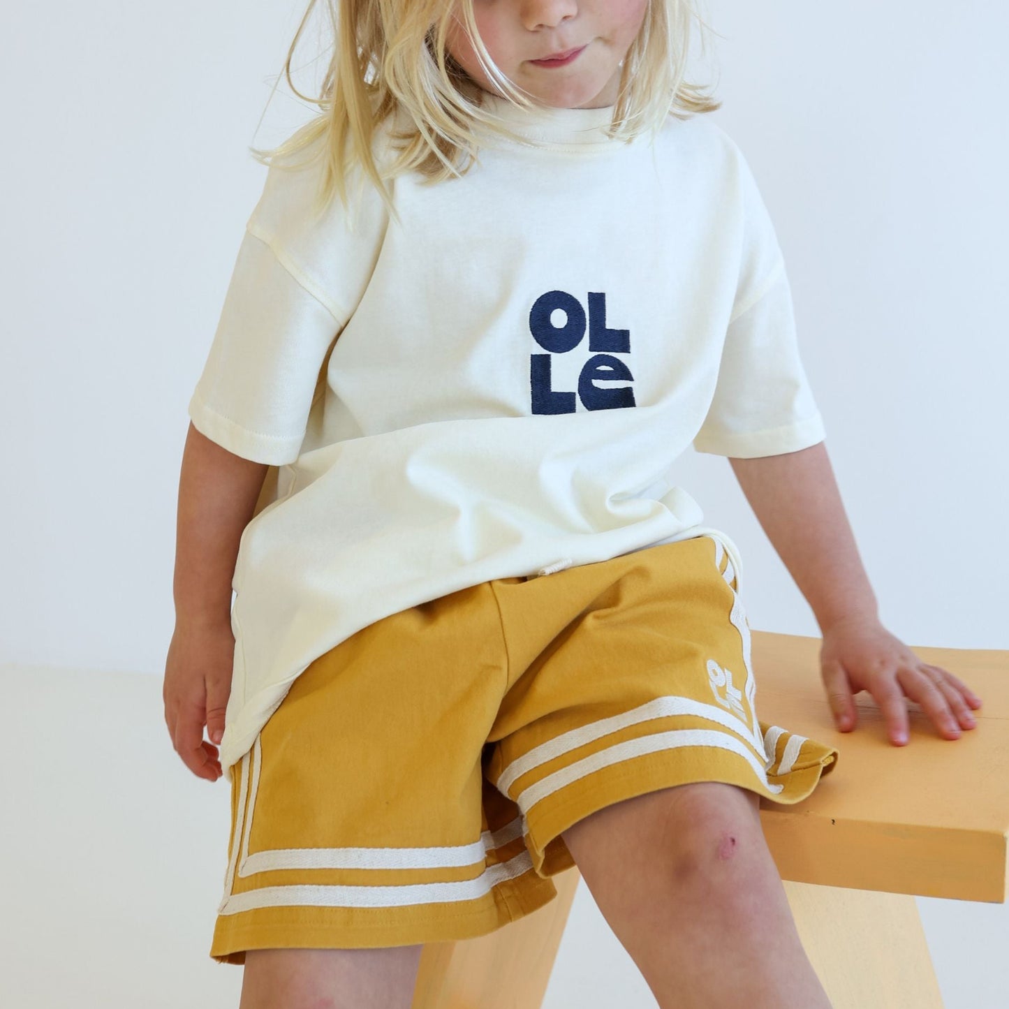 Children’s organic cotton Easy Short in Sunflower yellow by OLLE, with relaxed fit and embroidery