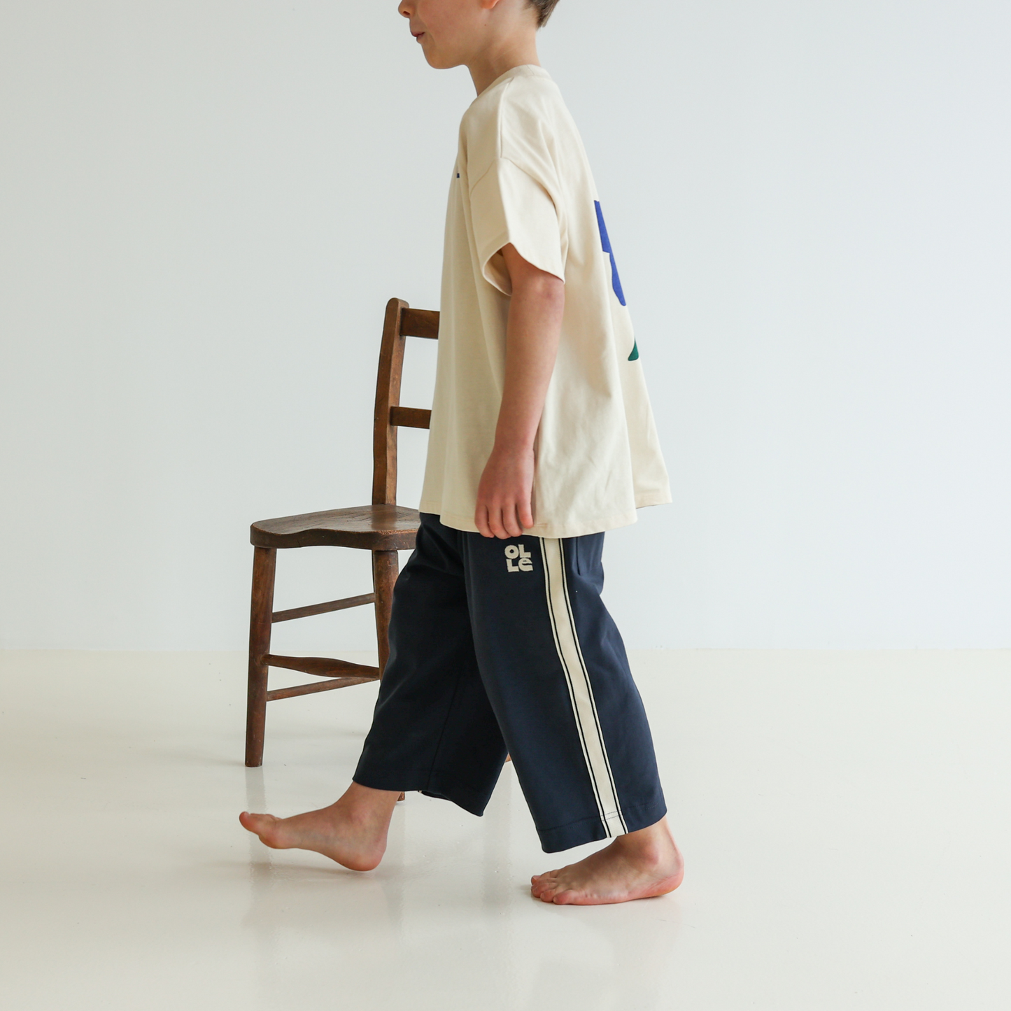 Children’s organic cotton t-shirt by OLLE in Sand colour with oversized fit and back print