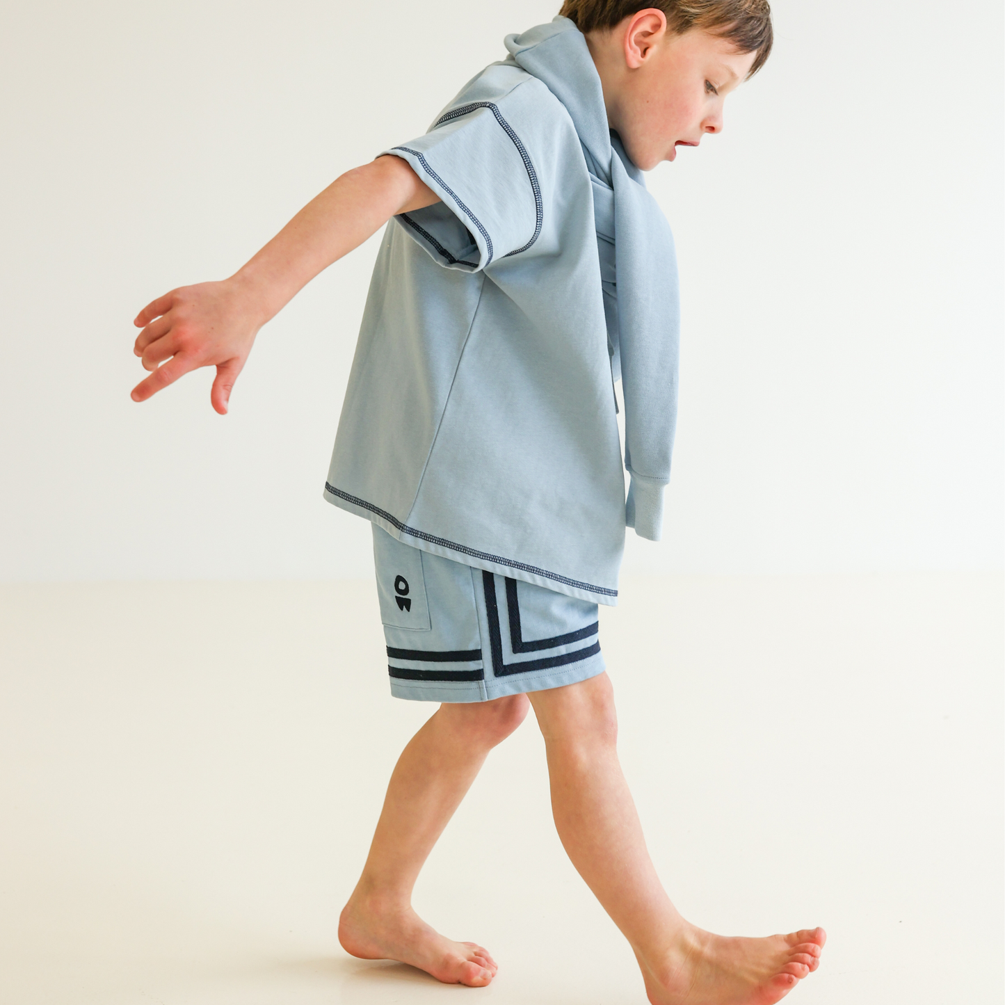 Children’s oversized organic cotton Topstitch Tee in Seafoam by OLLE, with contrast stitch and skate logo