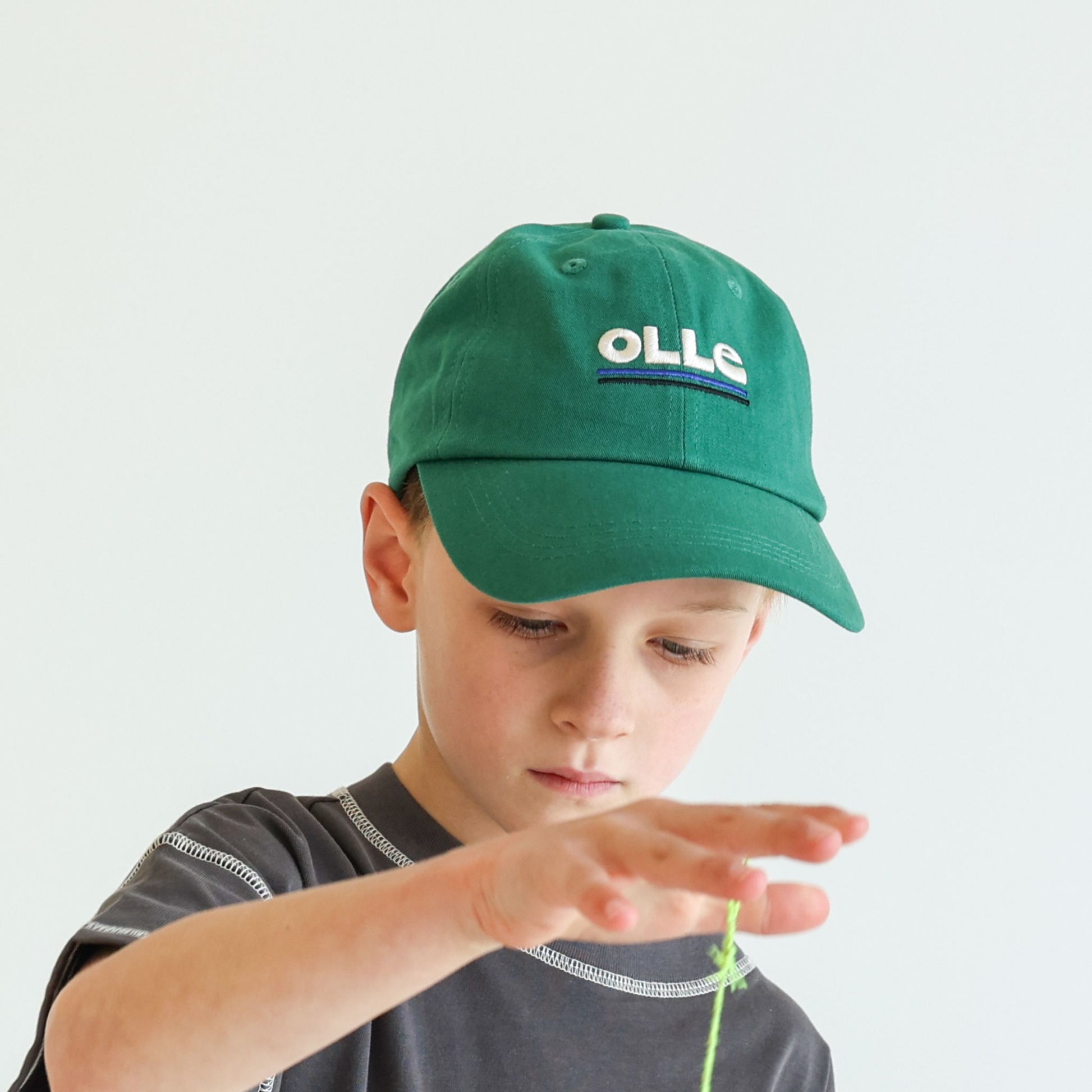 Children’s and adults’ adjustable organic cotton cap by OLLE, deeper profile with relaxed construction, responsibly made and eco-dyed