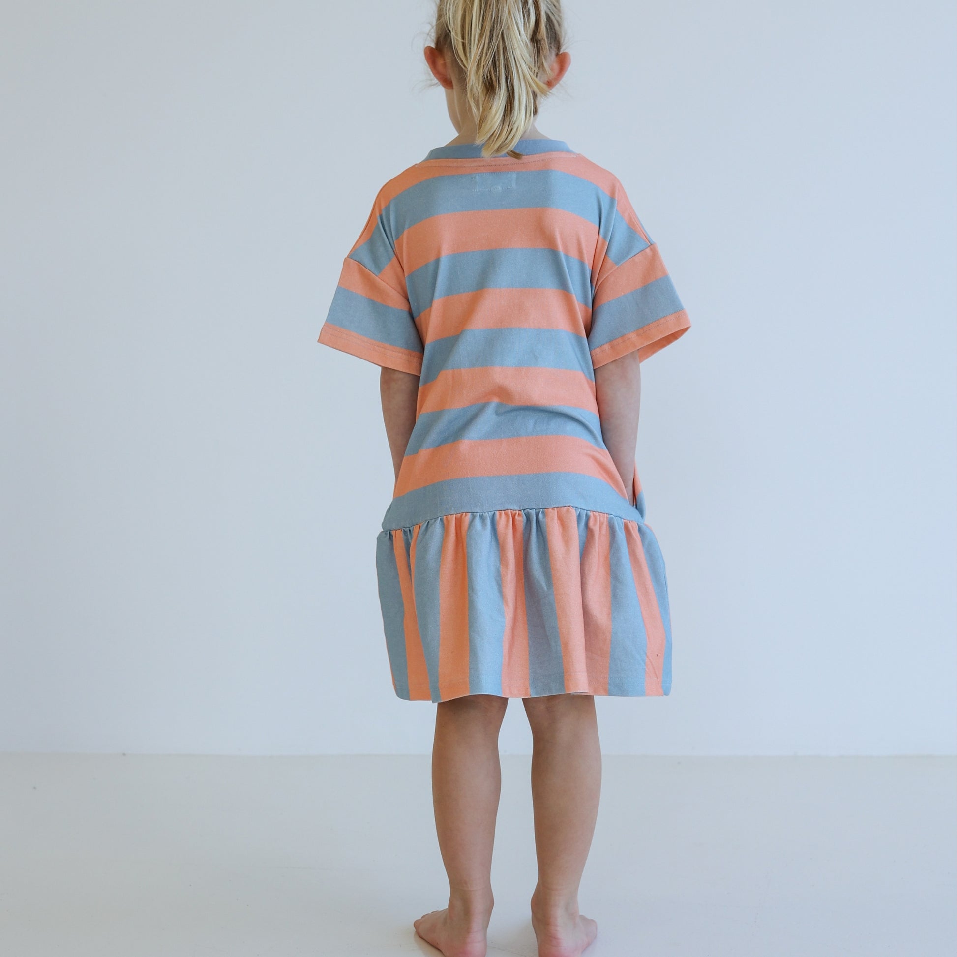 Children’s organic cotton Sherbet Stripe Dress by OLLE, with drop waist, bold stripes, and chest embroidery