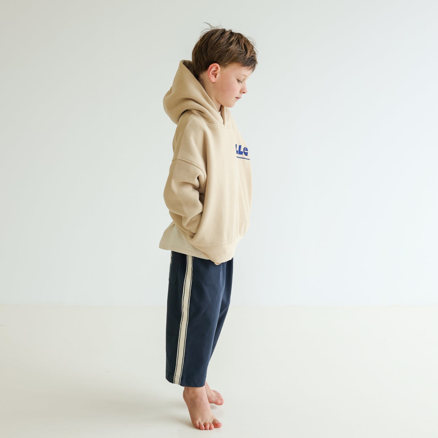 Children’s organic cotton Skate Hoodie in Sand by OLLE, with relaxed fit, embroidery, and double-layer hood