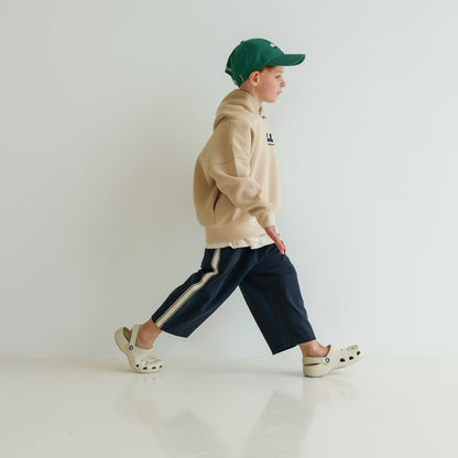 Children’s organic cotton Skate Hoodie in Sand by OLLE, with relaxed fit, embroidery, and double-layer hood