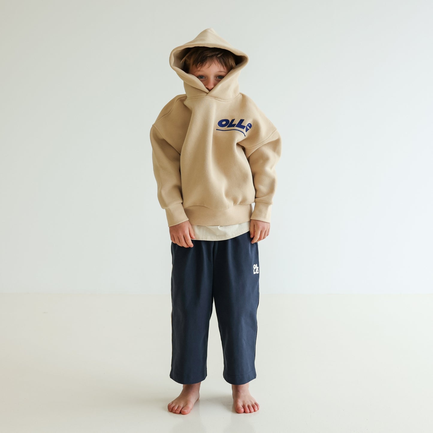 Children’s organic cotton Skate Hoodie in Sand by OLLE, with relaxed fit, embroidery, and double-layer hood