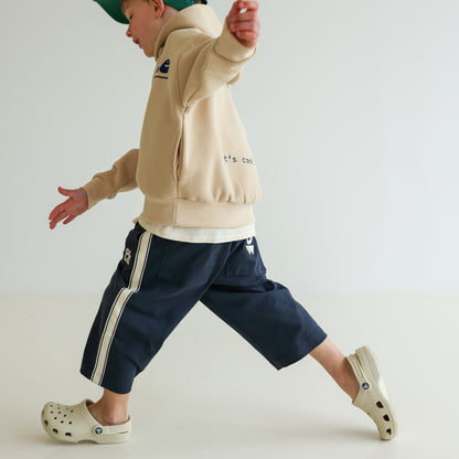 Children’s organic cotton Alltime Crop Pant in Midnight by OLLE, with cropped length and drawstring waist