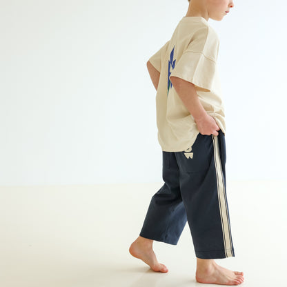 Children’s organic cotton Alltime Crop Pant in Midnight by OLLE, with cropped length and drawstring waist