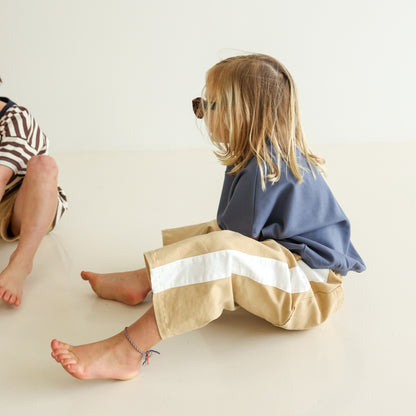Children’s organic cotton Alltime Crop Pant in Sand by OLLE, with cropped length and drawstring waist.