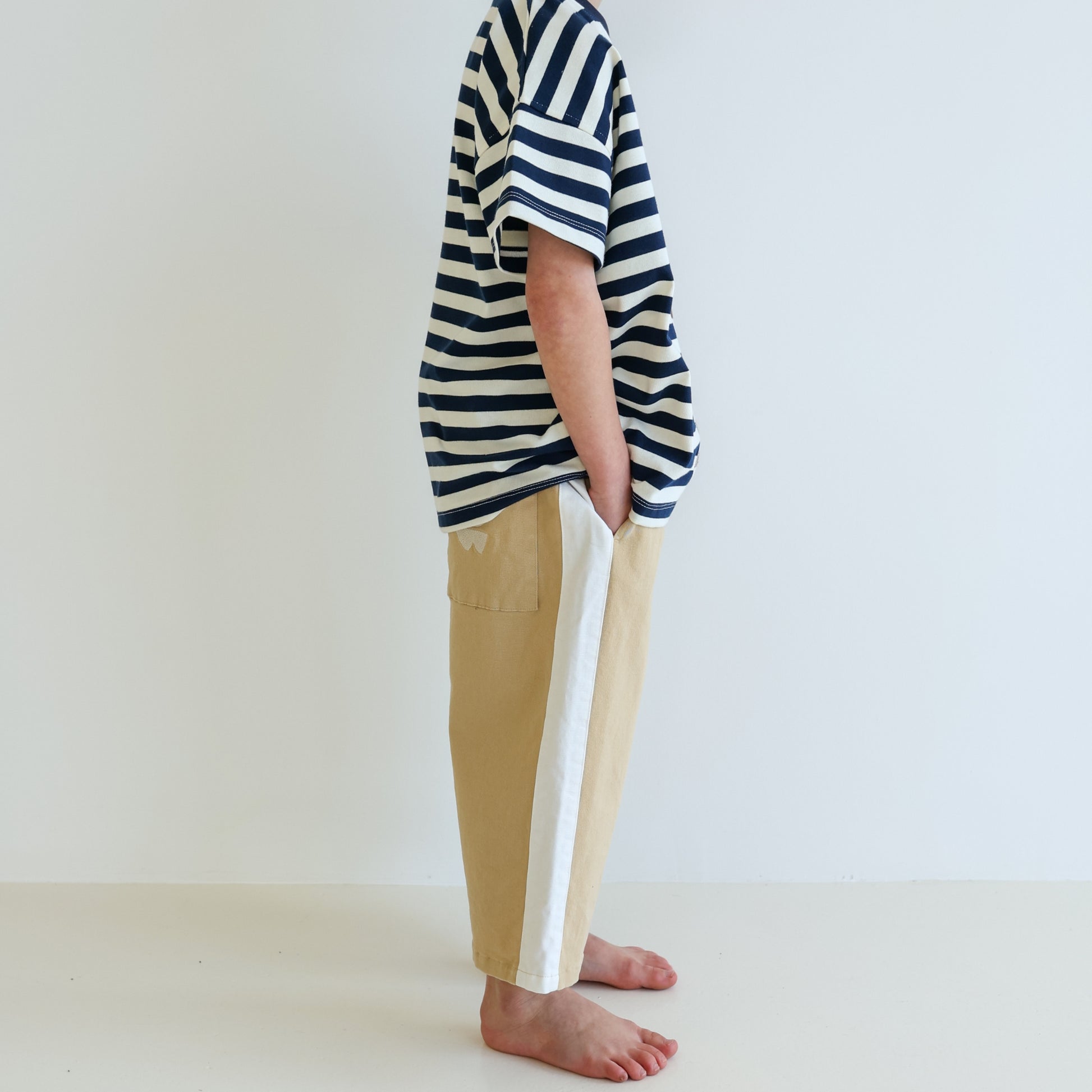 Children’s organic cotton Alltime Crop Pant in Sand by OLLE, with cropped length and drawstring waist.