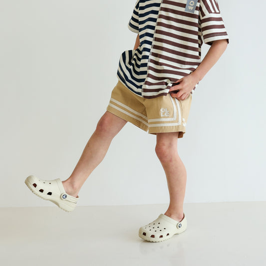 Children’s organic cotton Easy Short in Sand by OLLE, with relaxed fit and embroidery