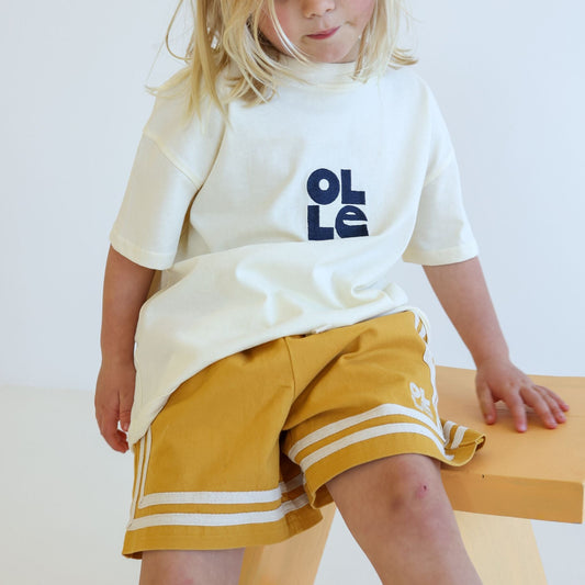 Children’s organic cotton Easy Short in Sunflower yellow by OLLE, with relaxed fit and embroidery
