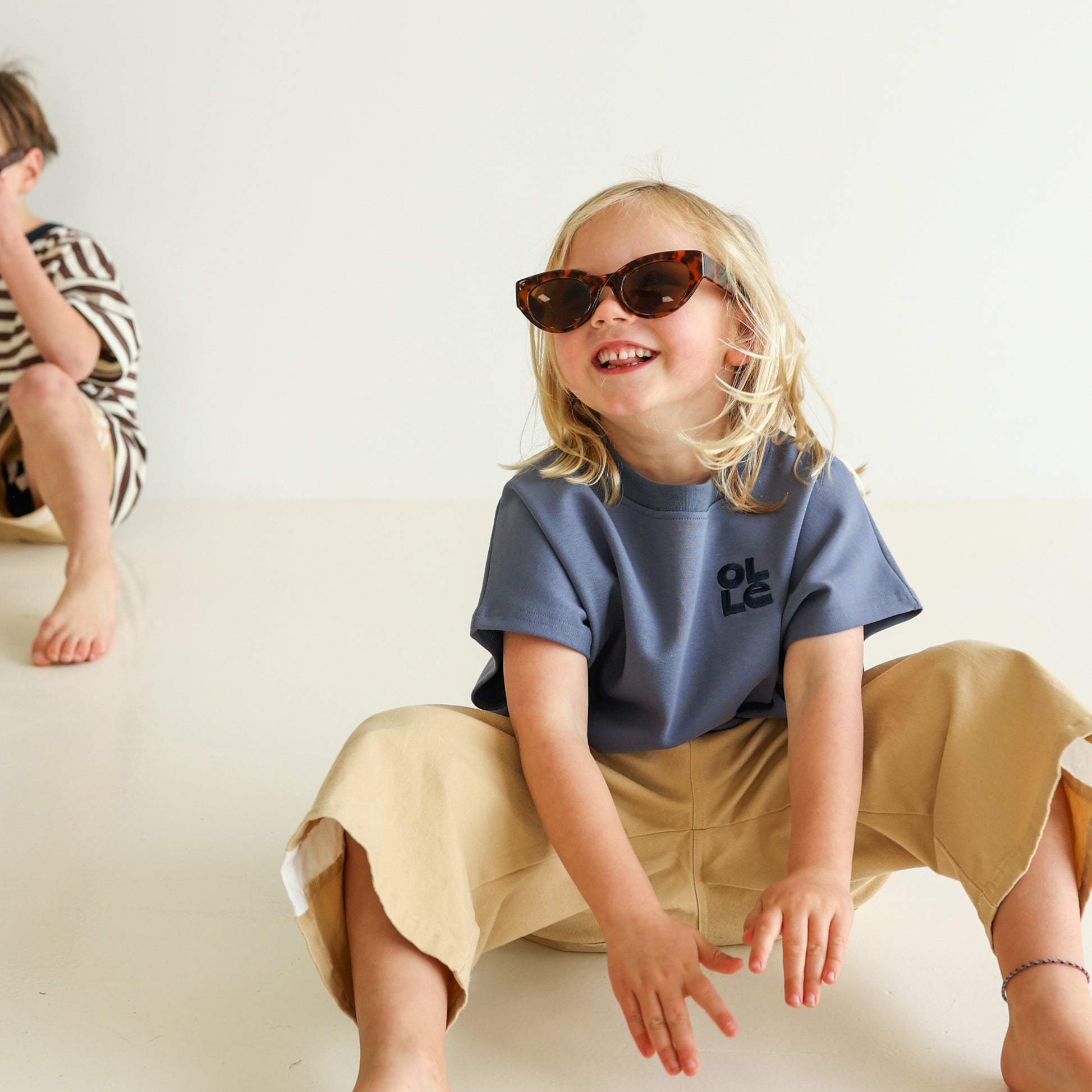 Children’s oversized organic cotton tank by OLLE, made from soft interlock fabric. Perfect for layering or wearing on its own