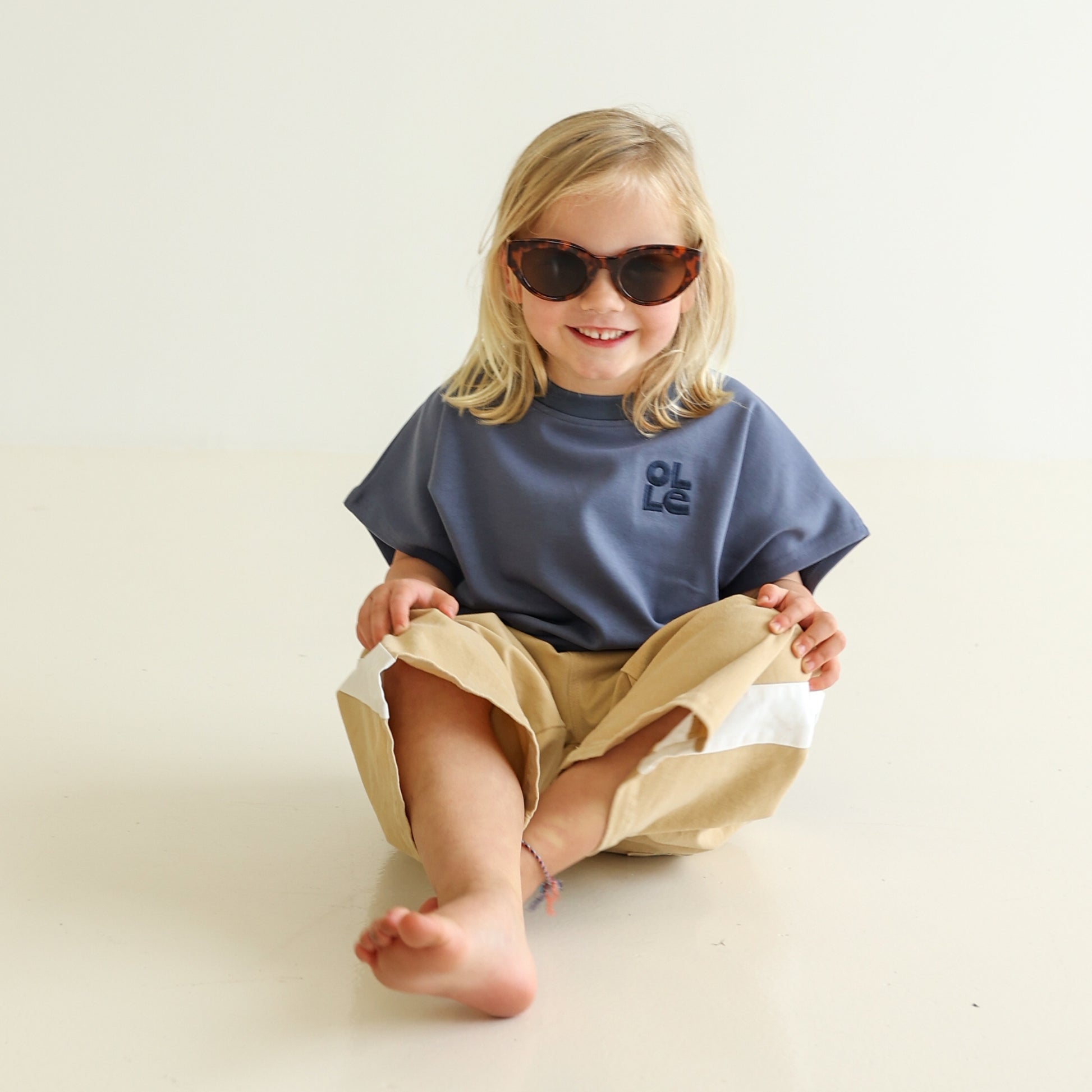 Children’s oversized organic cotton tank by OLLE, made from soft interlock fabric. Perfect for layering or wearing on its own