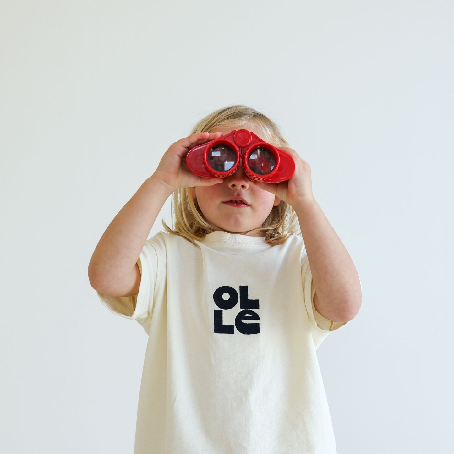 Children’s organic cotton OG Tee in Ecru by OLLE, with Midnight embroidery and relaxed fit