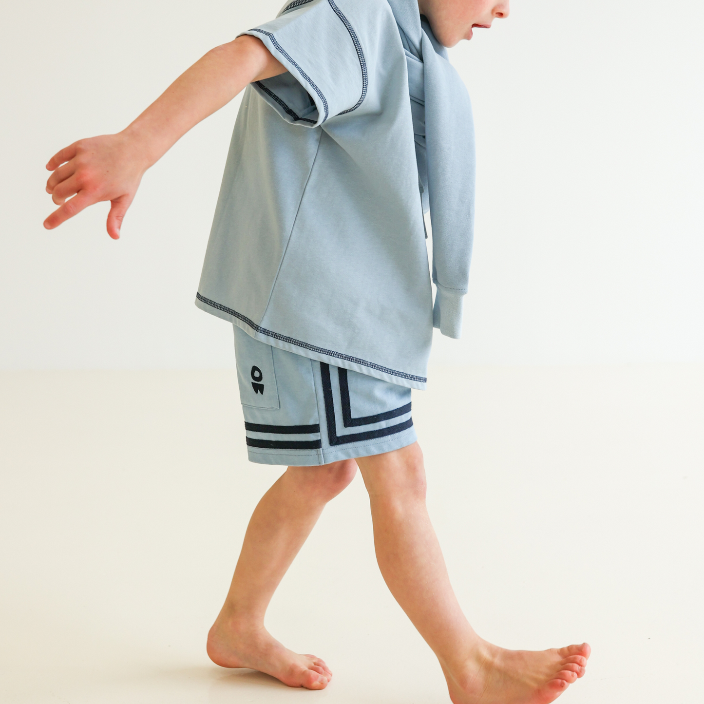 Children’s oversized organic cotton Topstitch Tee in Seafoam by OLLE, with contrast stitch and skate logo