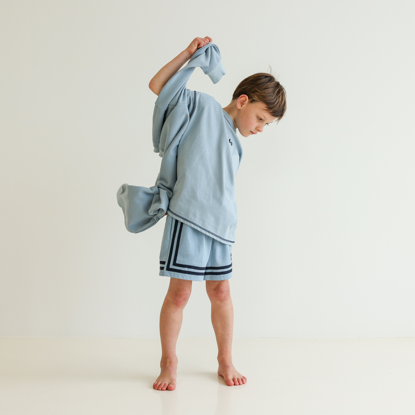 Children’s oversized organic cotton Topstitch Tee in Seafoam by OLLE, with contrast stitch and skate logo
